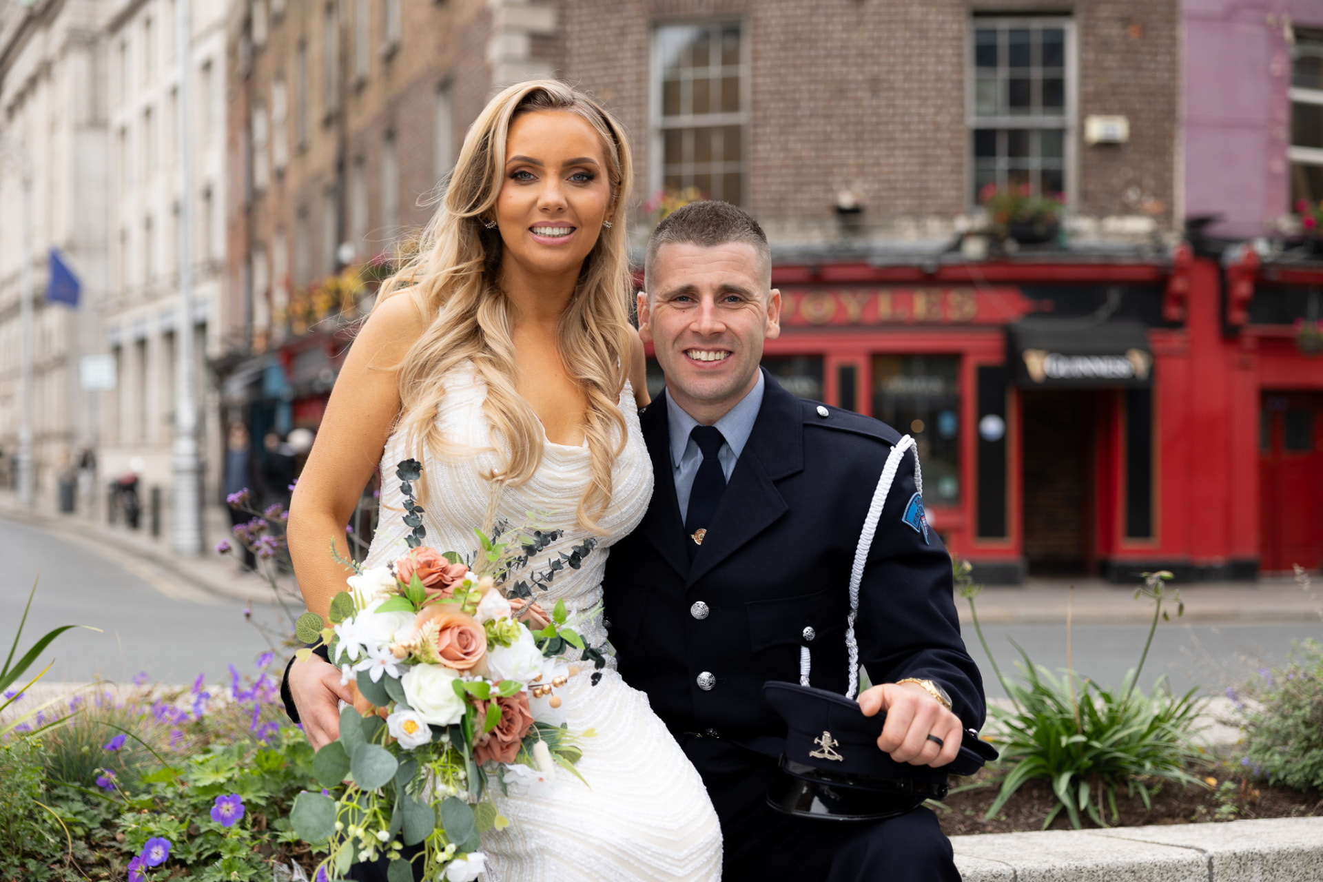 Bride and groom in uniform on a Dublin street