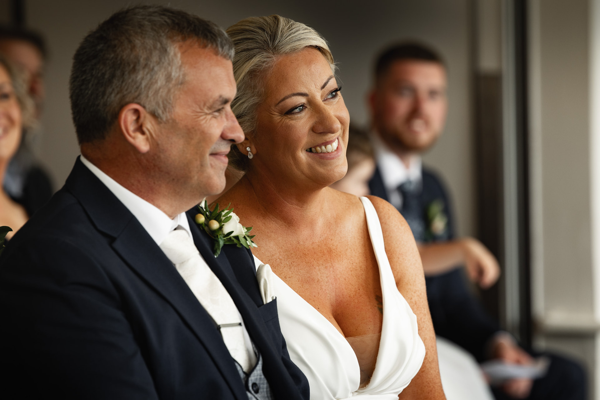 Bride and groom seated together during the ceremony