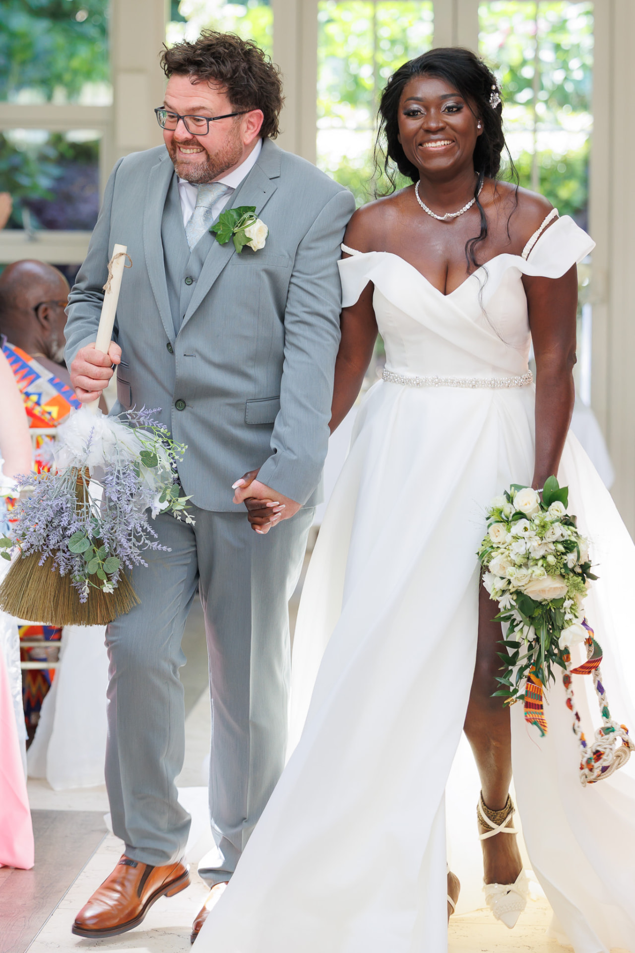 Bride and groom walking back down the aisle together
